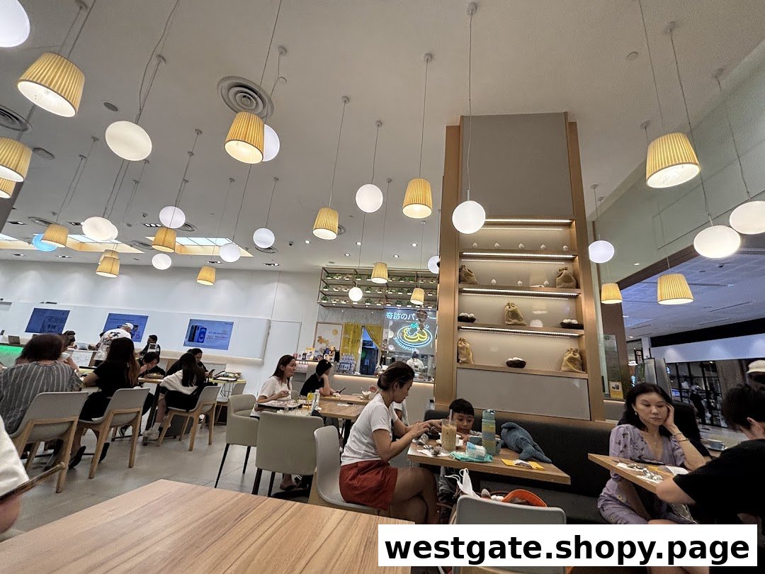 Customers enjoying a meal inside Flippers Westgate, featuring modern lighting and a comfortable dining area.