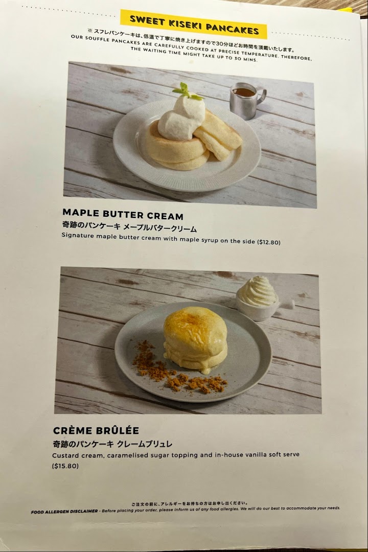 A menu displaying delicious soufflé pancakes, including Maple Butter Cream and Crème Brûlée options.