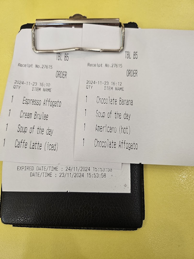 Two order slips from Flippers Westgate displaying a variety of food and drink items.