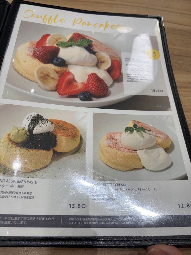 A menu page from Flippers Westgate showcasing various souffle pancake options with prices and descriptions.