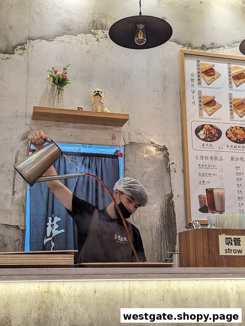 A staff member expertly prepares a drink behind the counter, with a menu board visible.