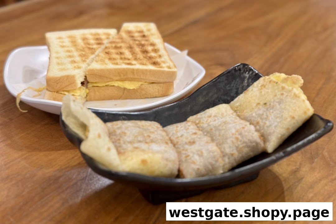 A toasted sandwich and a savory egg pancake roll served on a wooden table.