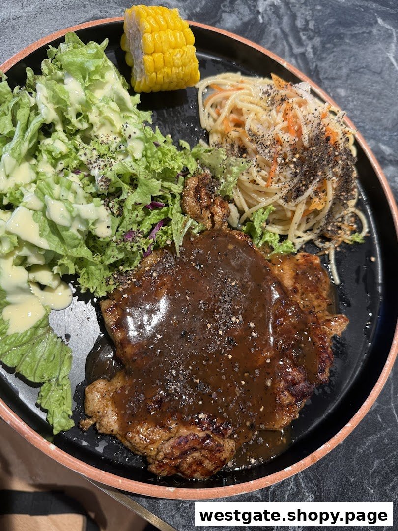 A close-up of a delicious meal featuring steak, pasta, salad, and corn on the cob.