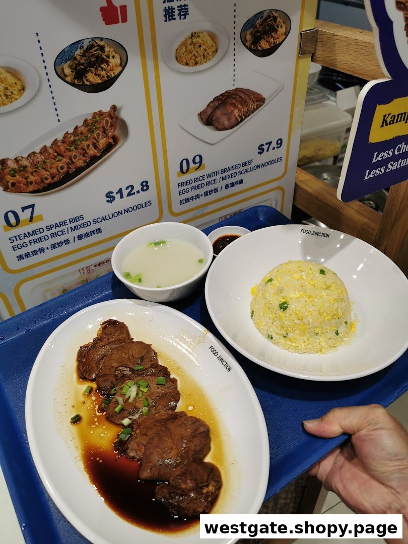 A delicious meal of braised beef and fried rice served on a tray with a menu display.