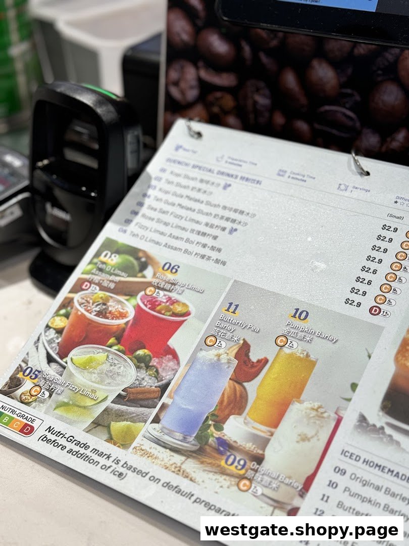 A close-up of a beverage menu displaying various refreshing drinks with prices and Nutri-Grade information.