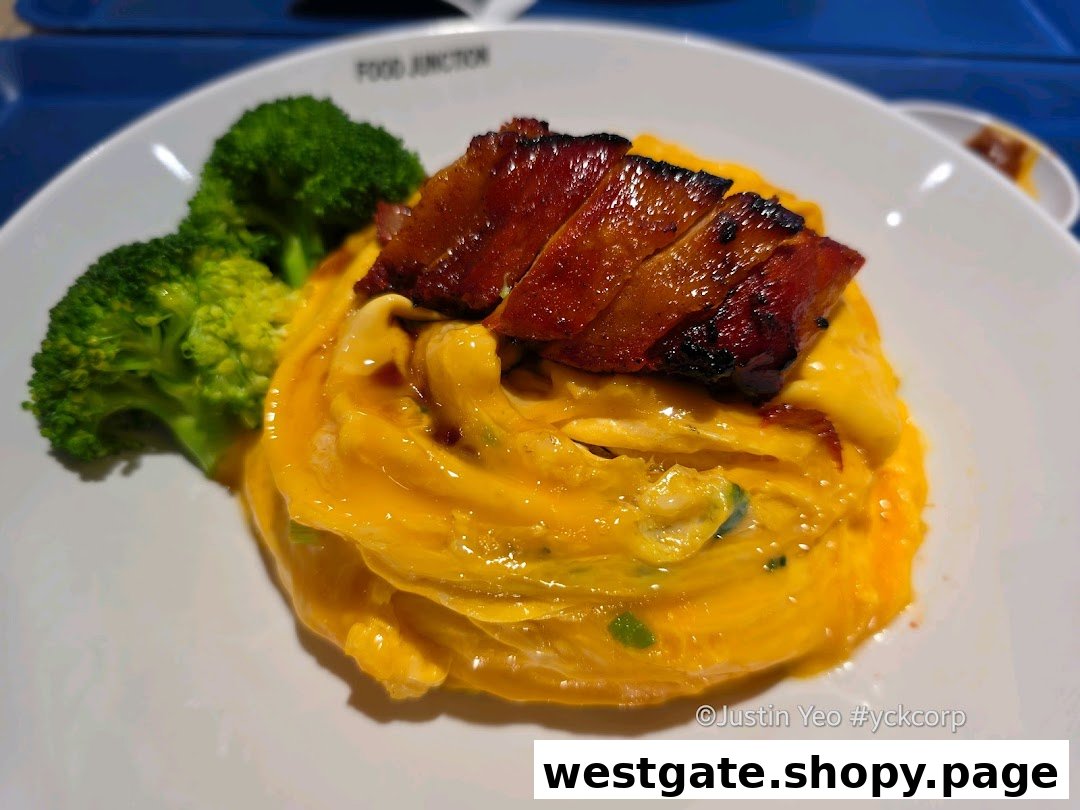 A plate of creamy scrambled eggs with roasted pork belly and fresh broccoli.