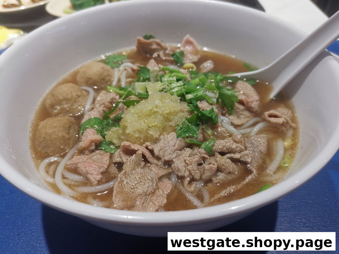 A close-up of a delicious bowl of beef noodles with meatballs and fresh herbs.