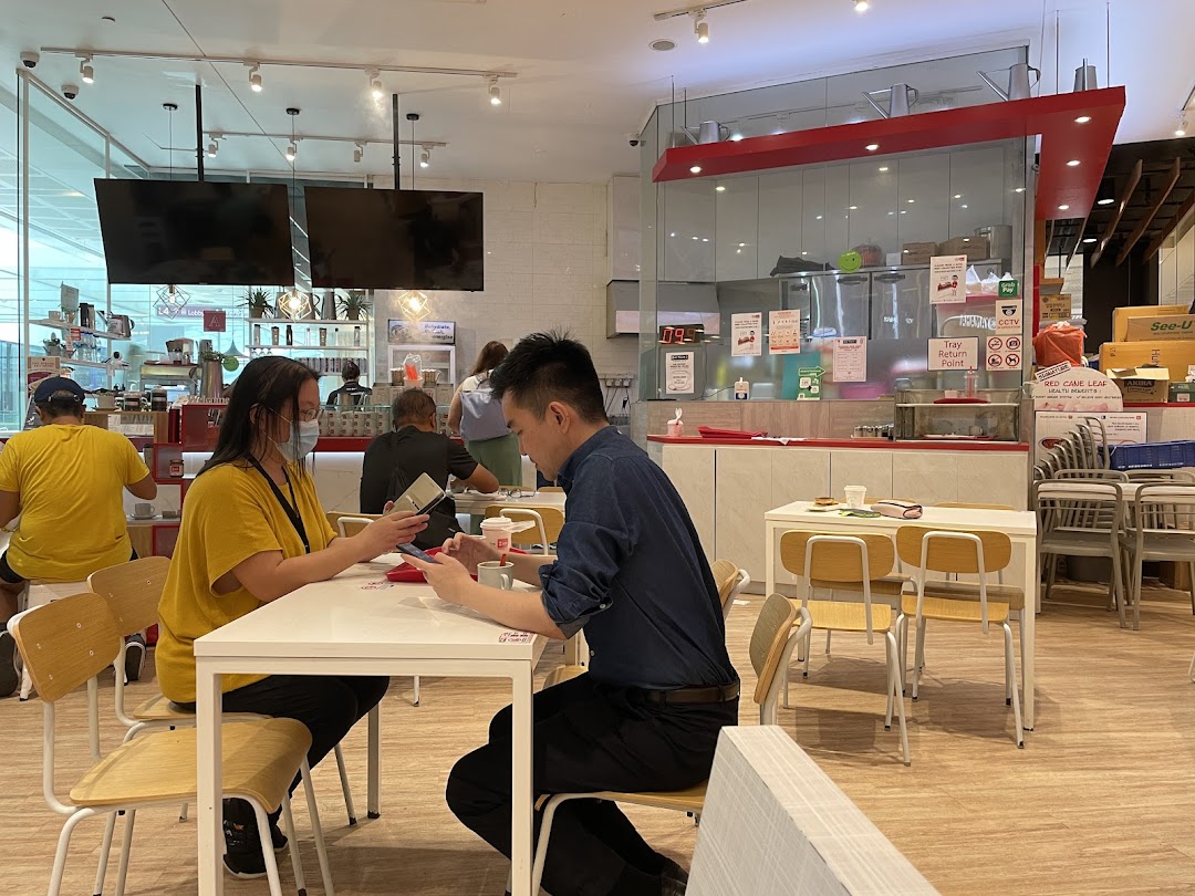 Customers enjoying a meal inside Fun Toast, featuring a bright, modern interior and counter area.