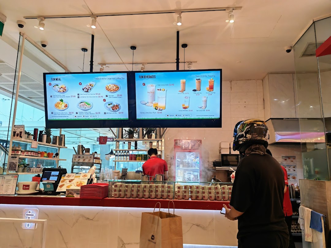 Interior view of Fun Toast counter with digital menus, staff, and a customer.
