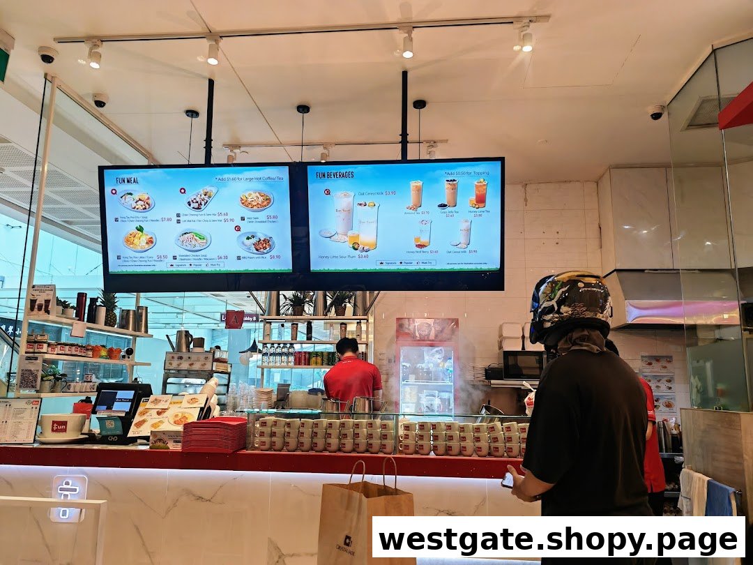 Interior view of Fun Toast counter with digital menus, staff, and a customer.