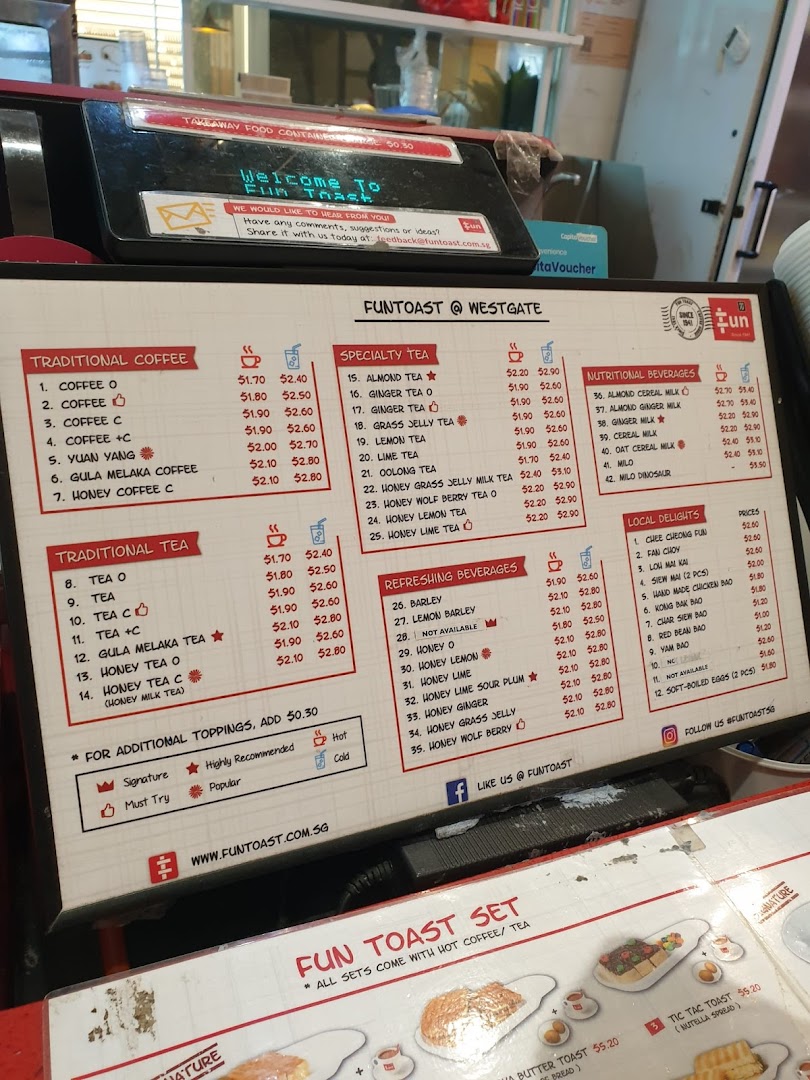 A comprehensive menu board for Fun Toast, showcasing a wide array of traditional beverages, specialty teas, and local delights with prices.