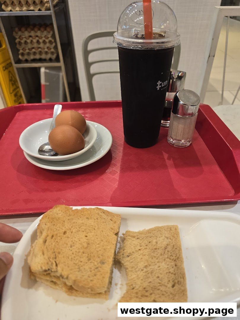 A tray featuring toast, soft-boiled eggs, and an iced beverage from Fun Toast.