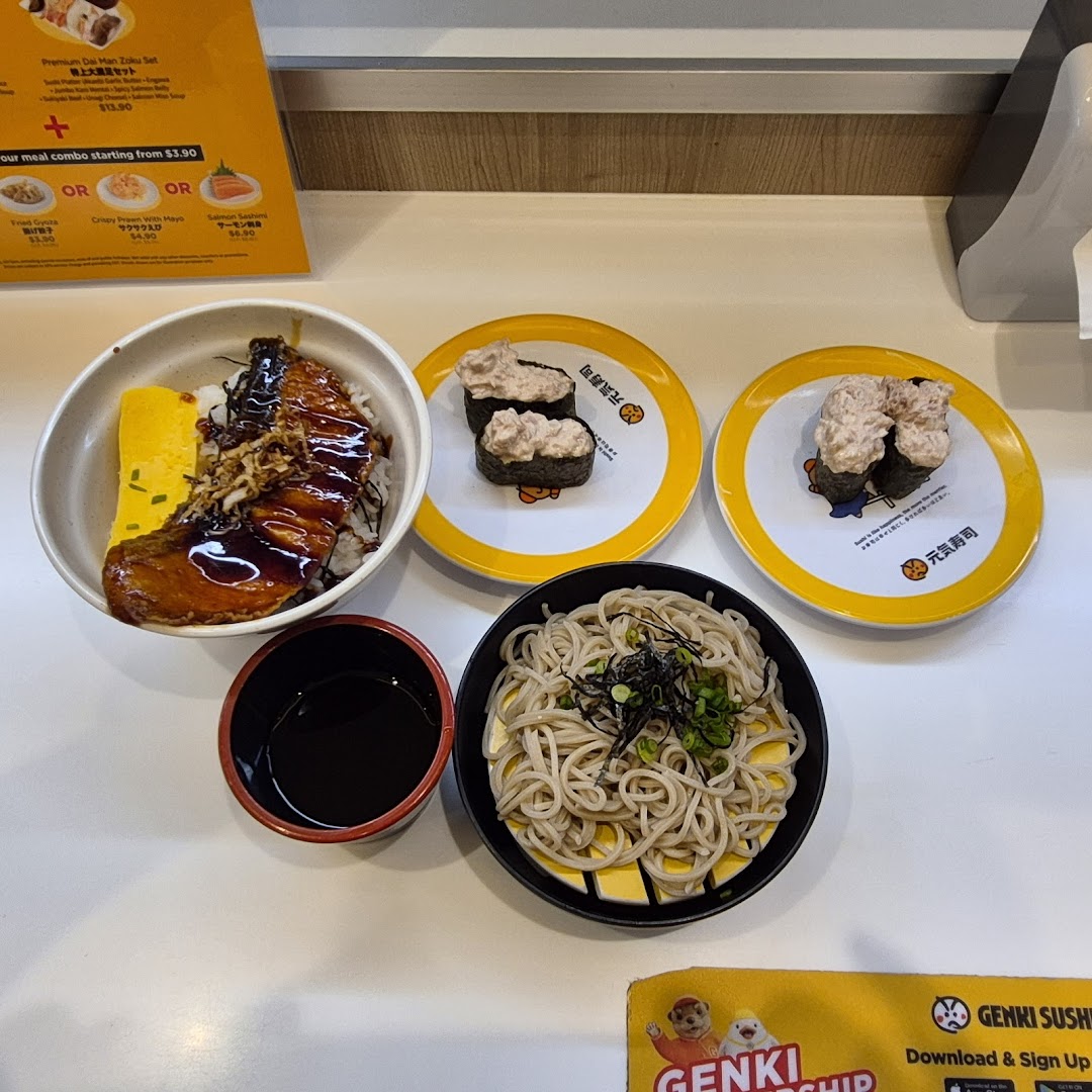A delicious spread of Japanese dishes including sushi, donburi, and soba noodles from Genki Sushi.
