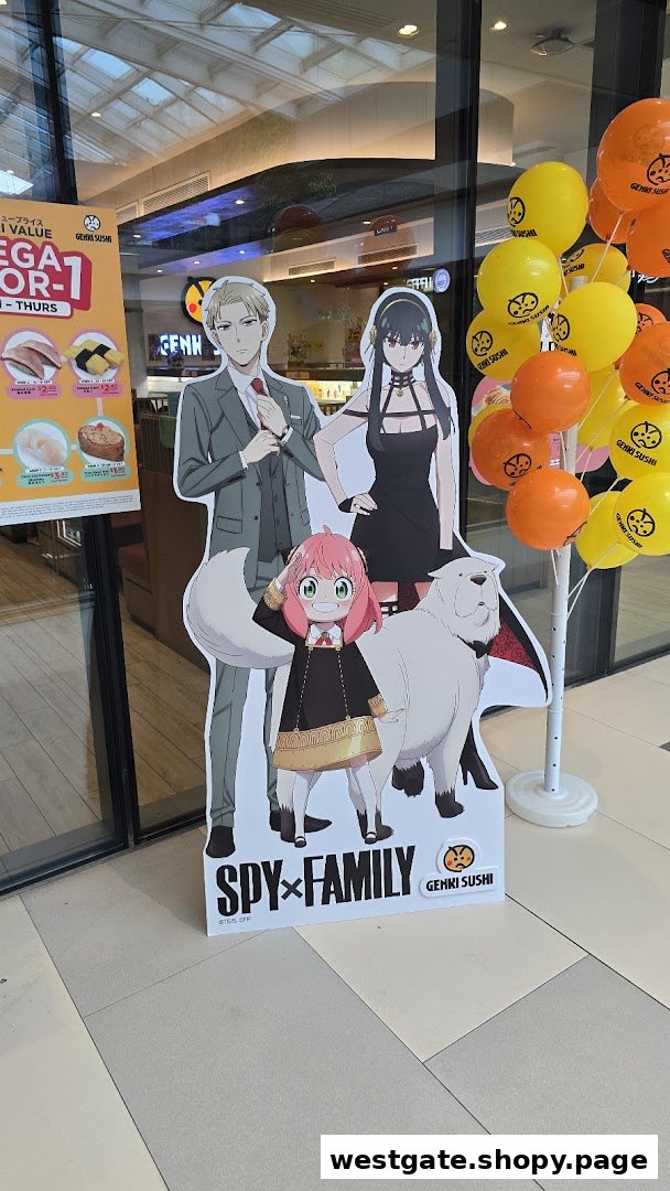 A promotional display at Genki Sushi featuring Spy x Family standees, balloons, and a special offer menu board.