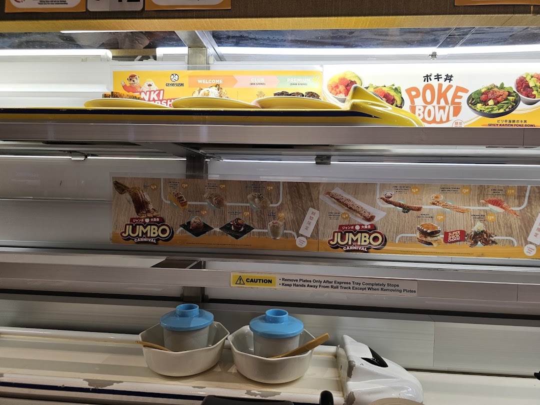 A view of Genki Sushi's express delivery system with promotional food displays and menu items.