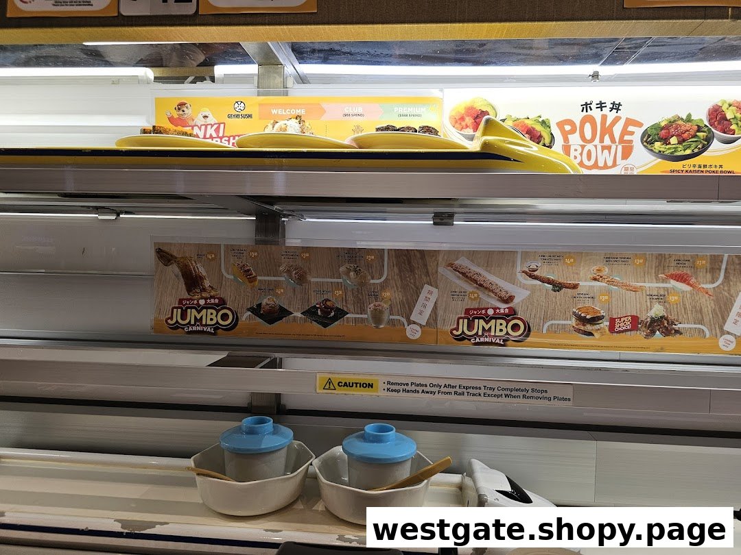 A view of Genki Sushi's express delivery system with promotional food displays and menu items.