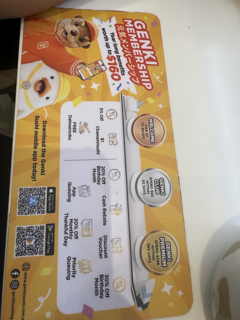 A Genki Sushi placemat detailing the benefits of their membership program and mobile app.
