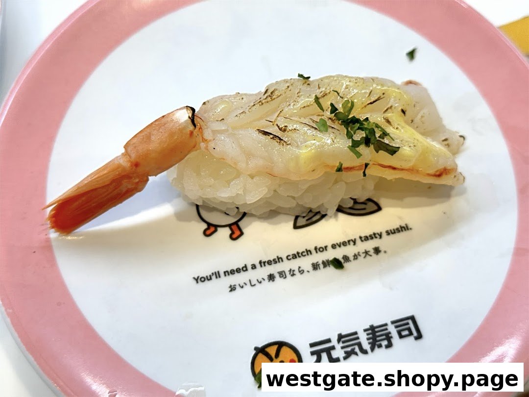 A close-up of a delicious shrimp sushi nigiri served on a branded Genki Sushi plate.