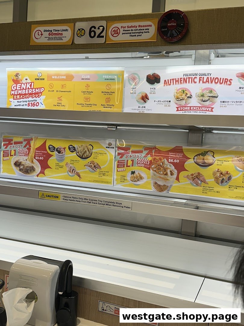 An interior view of Genki Sushi, showcasing its conveyor belt system, membership benefits, and various sushi and side dish promotions.