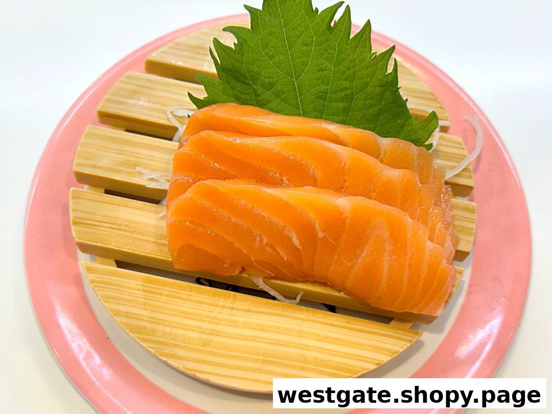 Close-up of fresh salmon sashimi slices served on a wooden plate with a shiso leaf.