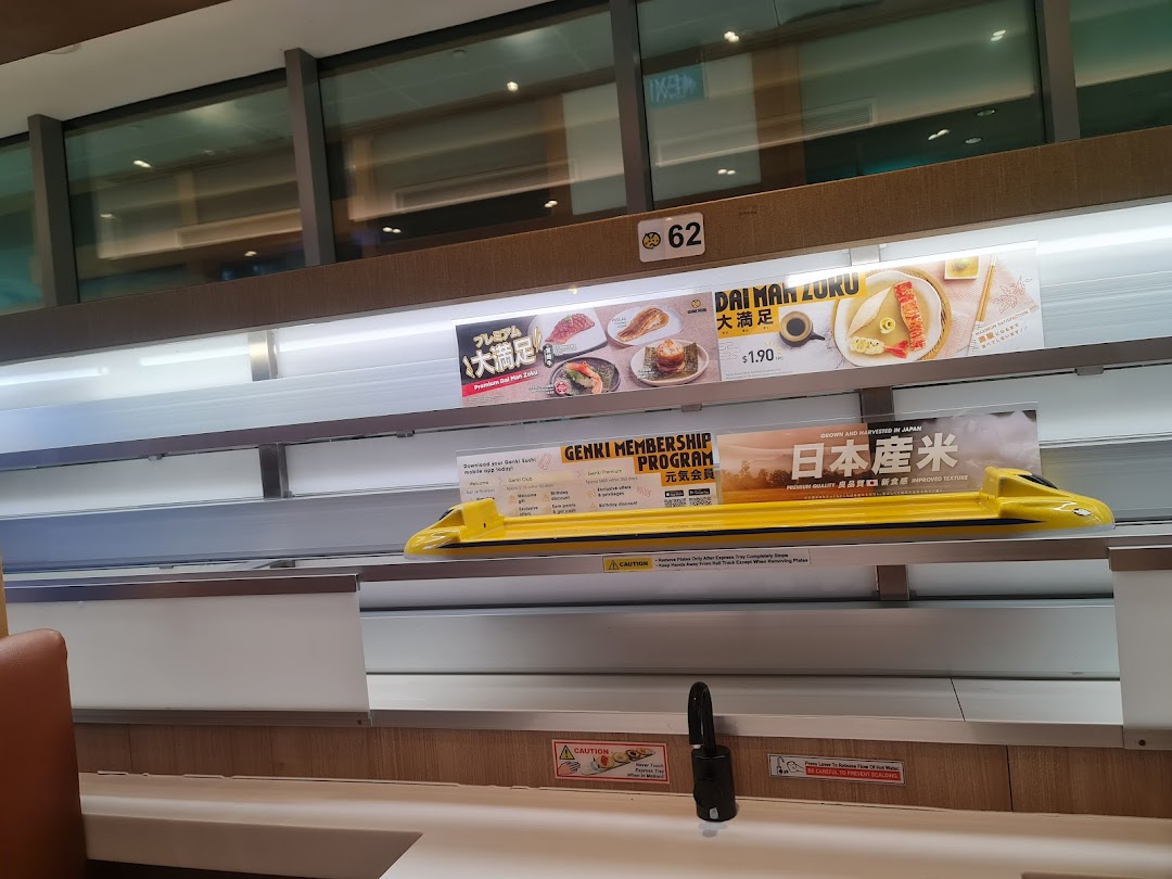 Interior view of Genki Sushi's express delivery system with promotional displays and seating.