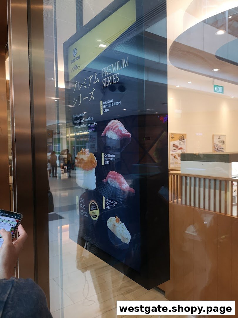 A digital display showcasing Genki Sushi's premium series sushi items with prices and descriptions.