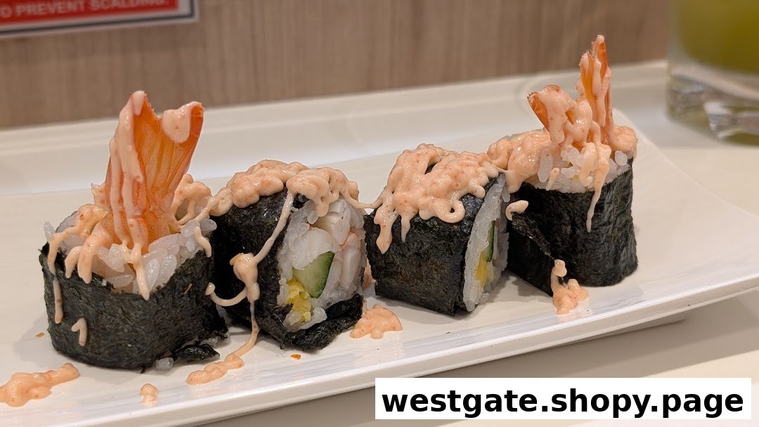 Close-up of delicious shrimp sushi rolls with creamy sauce on a white plate.