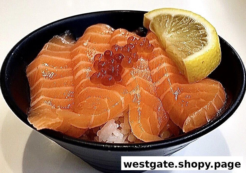 A close-up of a vibrant salmon donburi bowl topped with ikura and a fresh lemon slice.