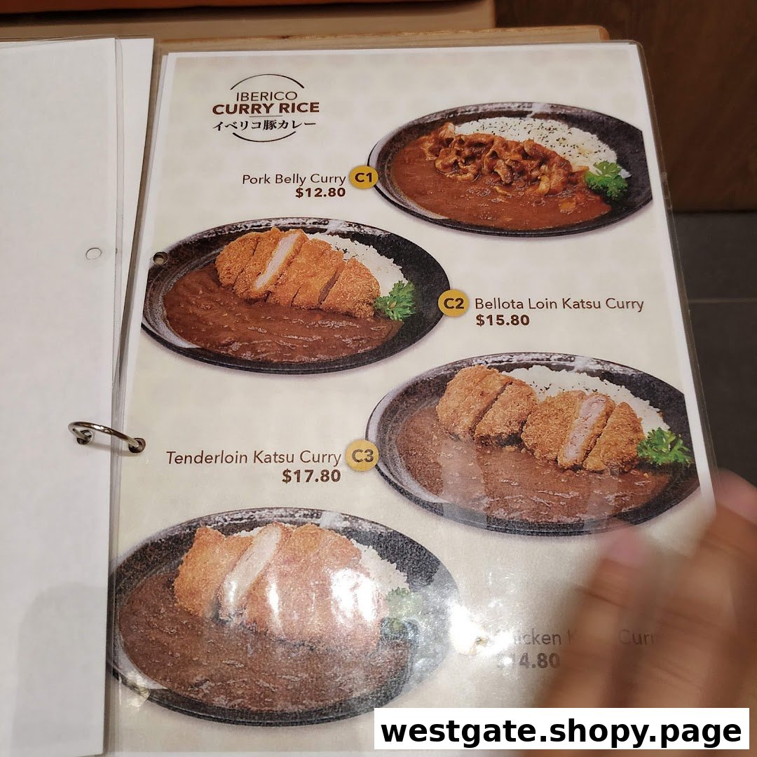 A menu page showcasing various Iberico pork and chicken curry rice dishes with prices.