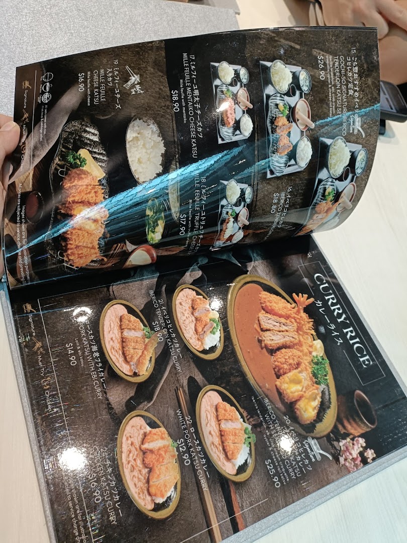 A detailed menu displaying various Japanese katsu and curry rice dishes with prices.