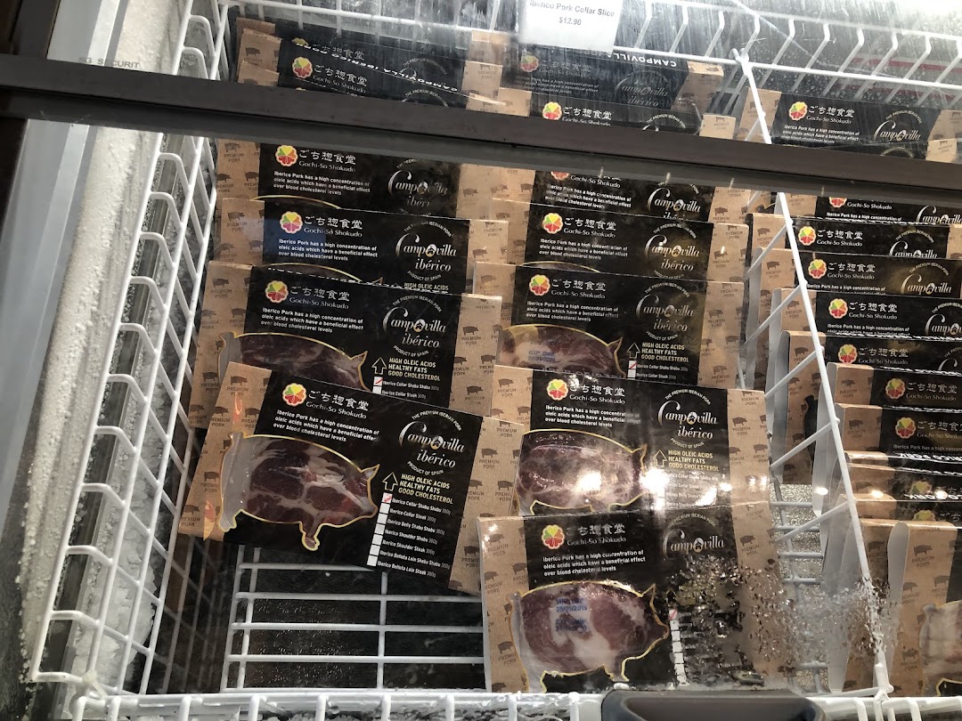 A freezer display showcasing various packaged Iberico pork products from Gochi-So Shokudo.