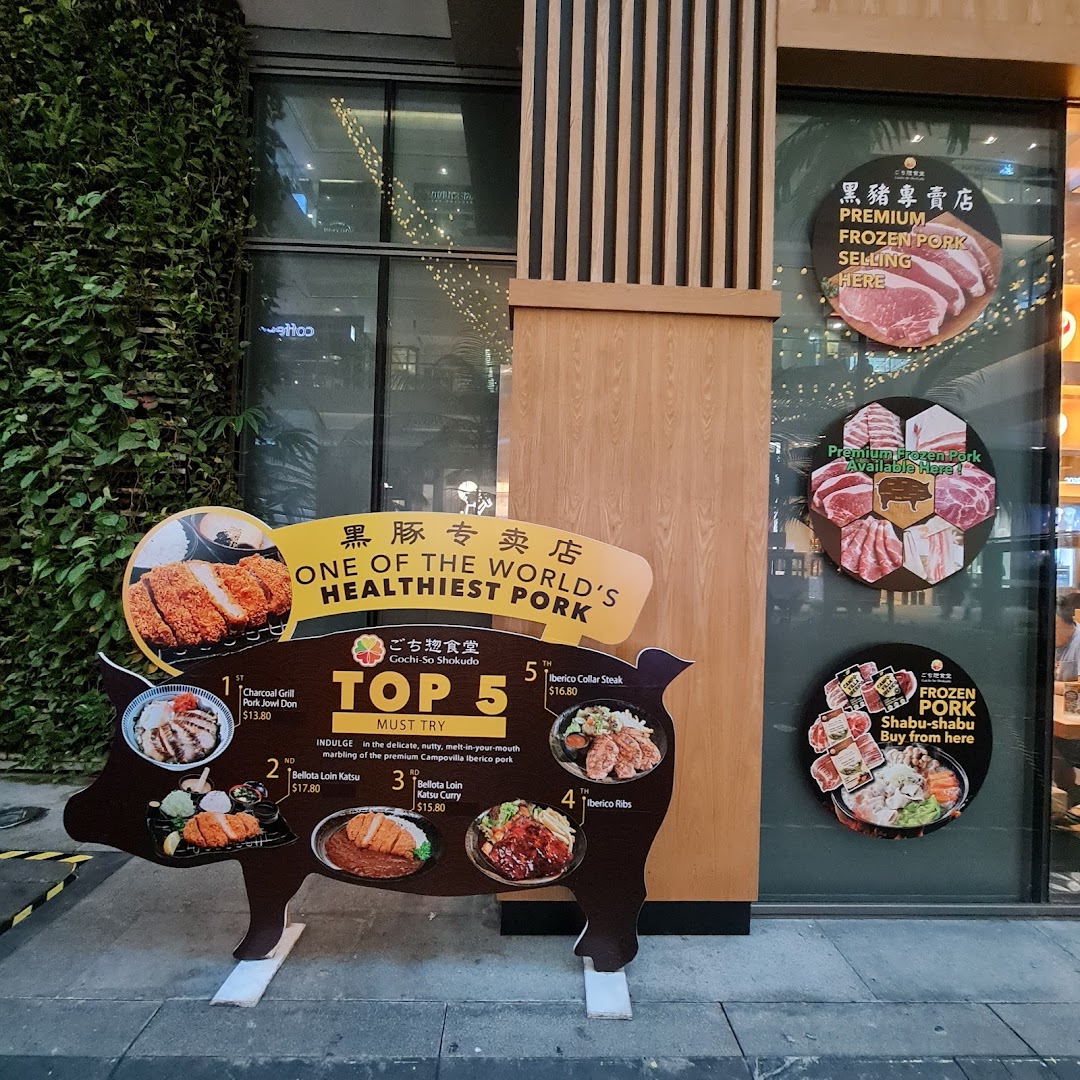 The shop front of Gochi-So Shokudo, featuring a pig-shaped display with 'Top 5 Must Try' Iberico pork dishes.