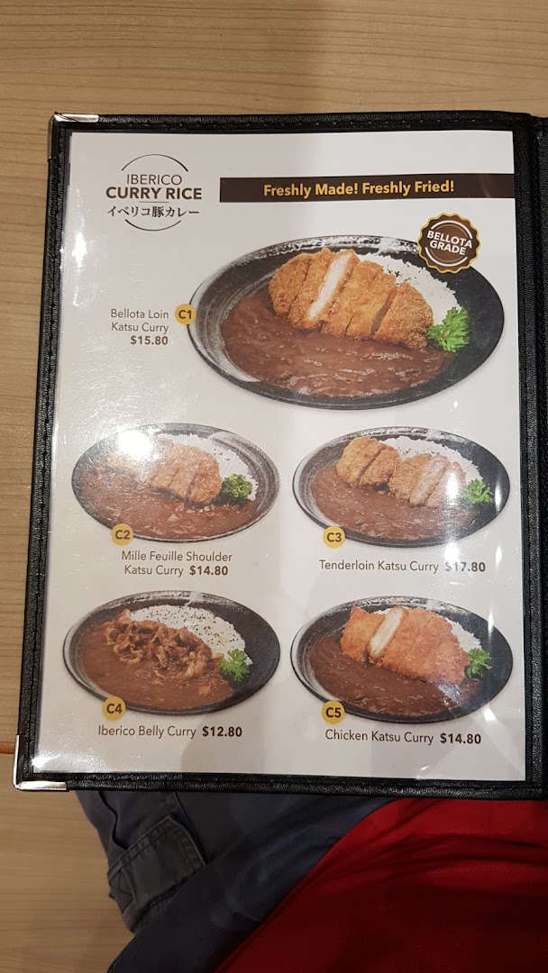 A menu page showcasing various Iberico and chicken katsu curry rice dishes with prices.