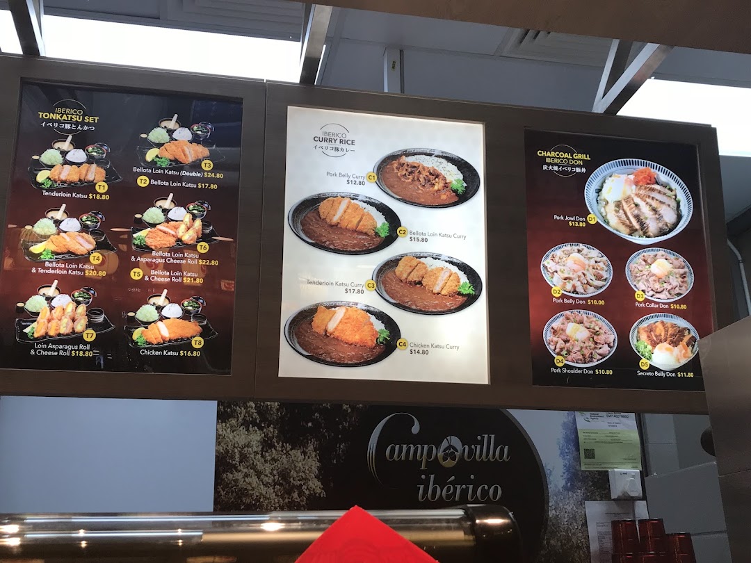 A vibrant display of Japanese menu boards featuring Iberico pork katsu, curry rice, and donburi dishes.