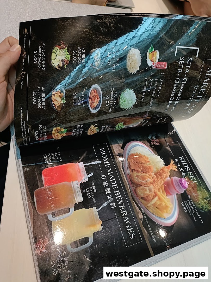 A close-up view of a Japanese restaurant menu, showcasing various dishes and beverages.