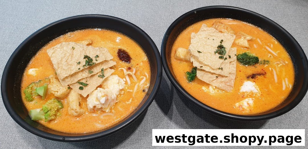 Two vibrant bowls of plant-based curry noodles with tofu, broccoli, and bean curd skin.