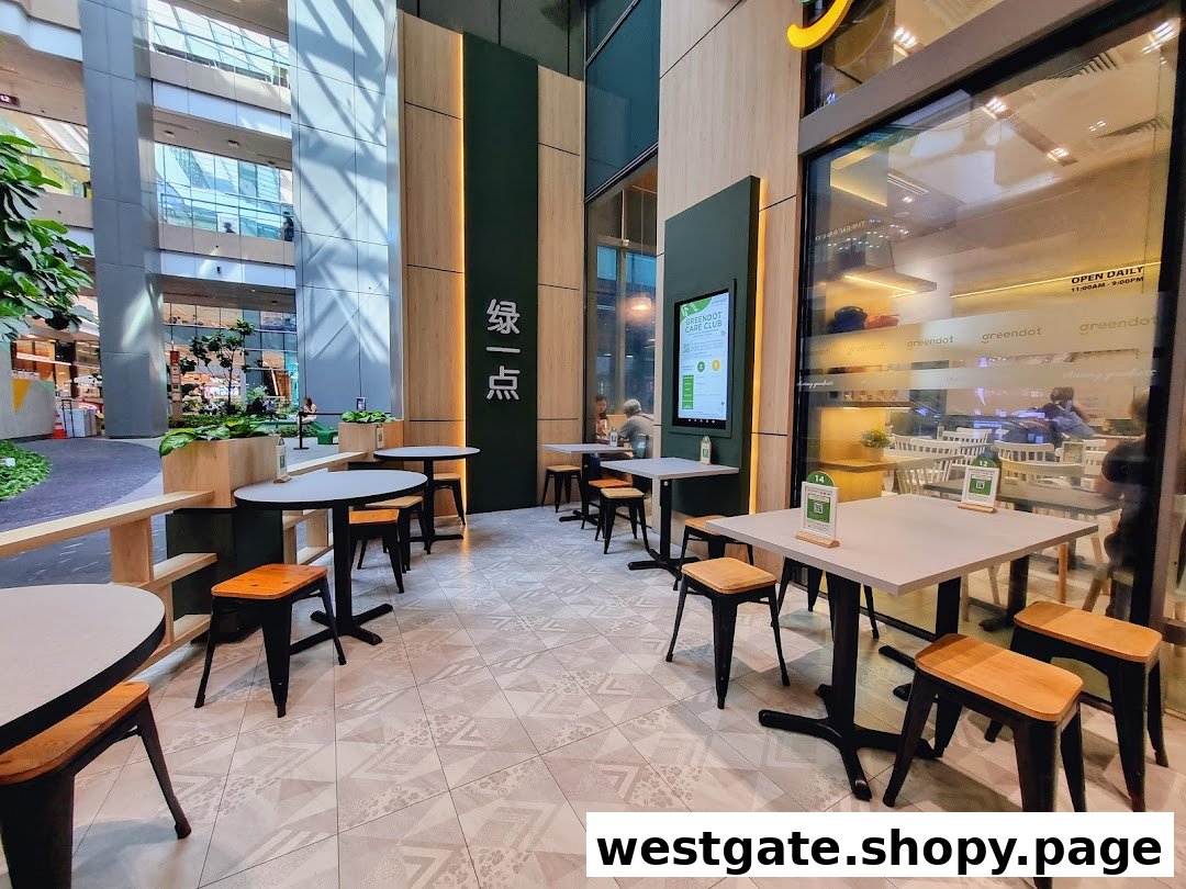 Greendot Westgate shopfront with inviting outdoor seating and a glimpse of the interior.