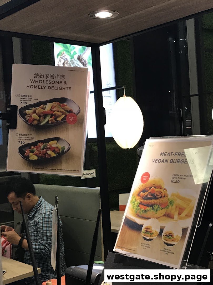 Two menu displays showcasing Greendot's wholesome vegan dishes and meat-free burgers.