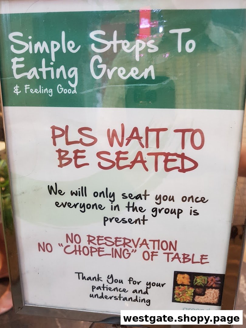 A sign at Greendot restaurant outlining seating policies and promoting healthy eating.