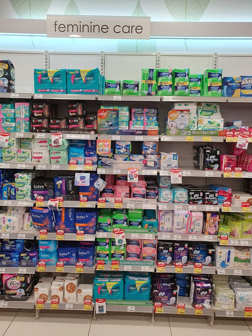 An aisle in Guardian Health & Beauty displaying a wide range of feminine care products.