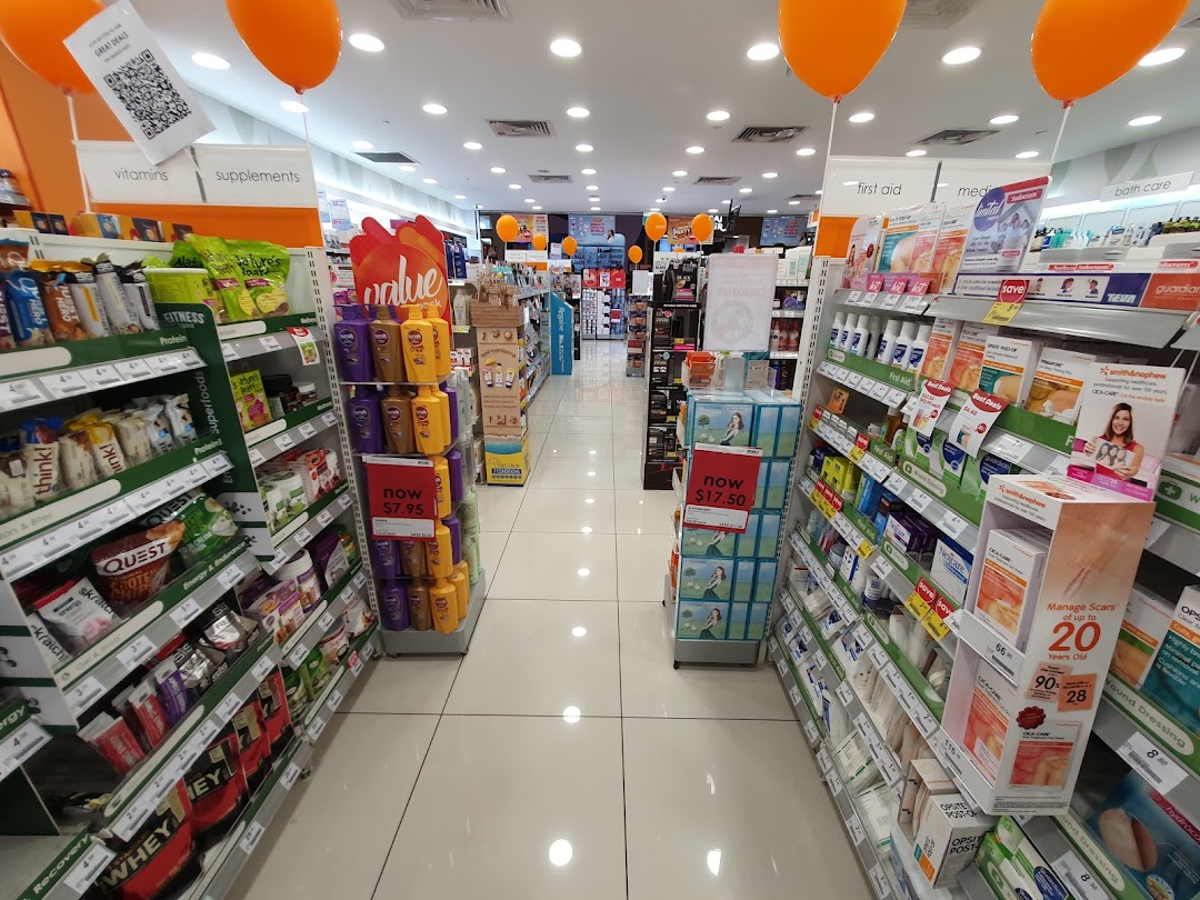 Interior view of Guardian Health & Beauty, showcasing aisles filled with health, beauty, and wellness products.