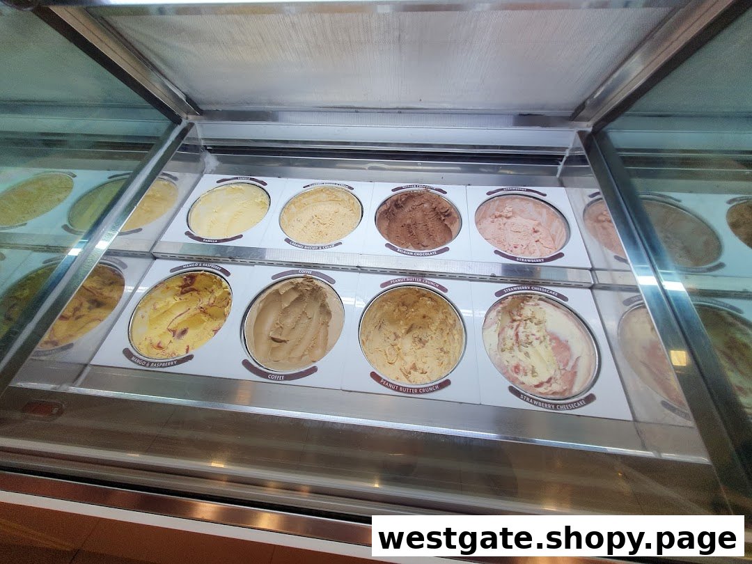 A vibrant display of various Häagen-Dazs ice cream flavors in a freezer.
