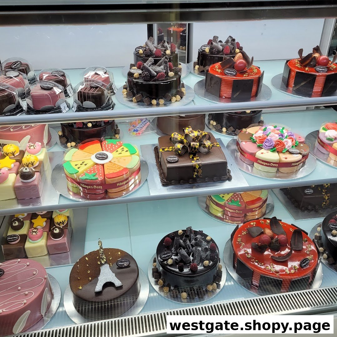 A display case filled with an assortment of Häagen-Dazs ice cream cakes and desserts.
