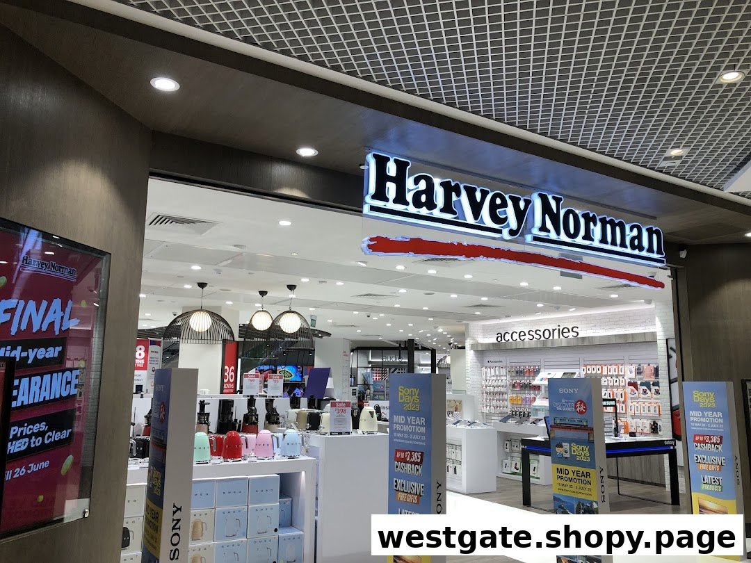 The brightly lit entrance of Harvey Norman, showcasing electronics, home appliances, and accessories with promotional displays.
