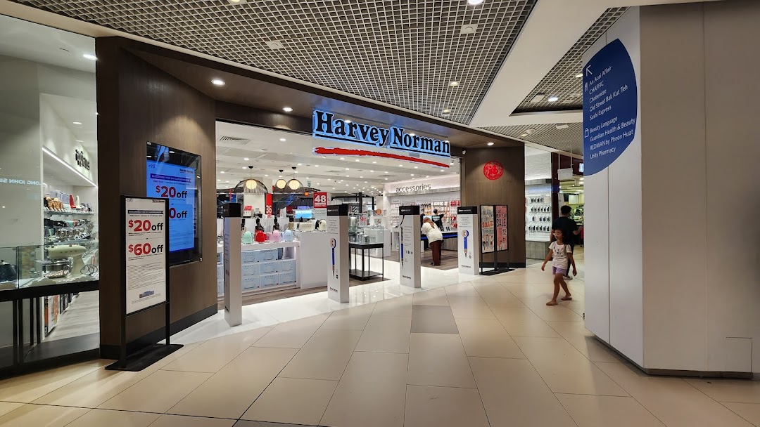 The inviting entrance of Harvey Norman at Westgate Mall, showcasing electronics and home appliances.