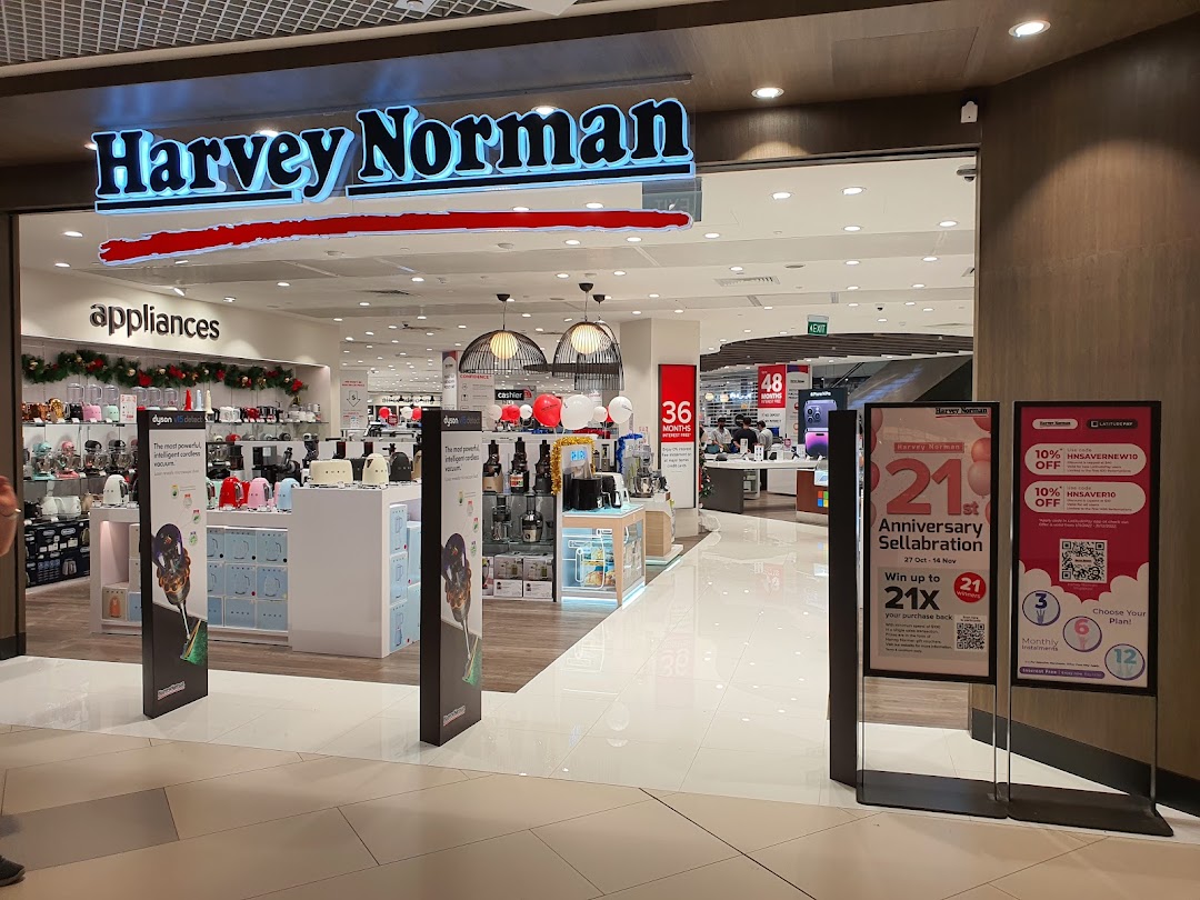 The entrance of Harvey Norman showcasing a wide range of electronics and home appliances.