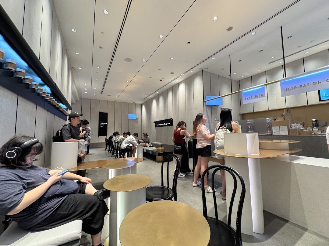Customers enjoying the modern interior and beverages at HEYTEA Westgate.