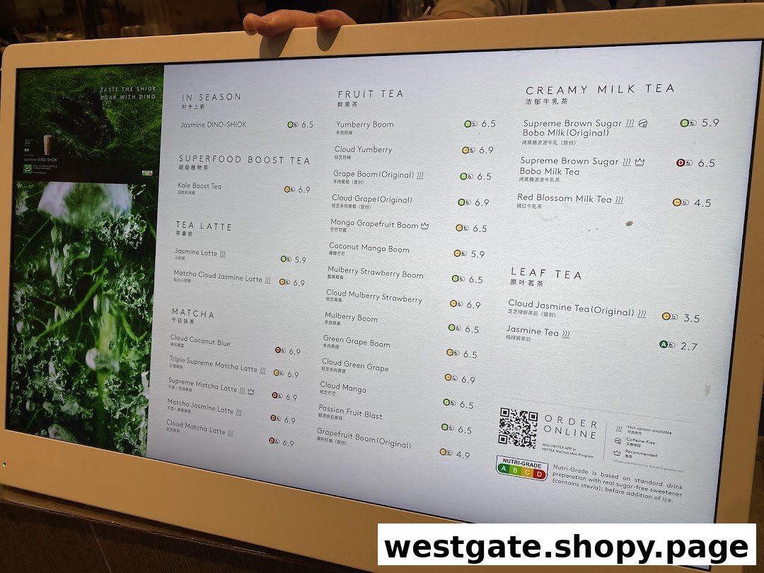 A digital menu board displaying various tea and beverage categories with prices at HEYTEA.
