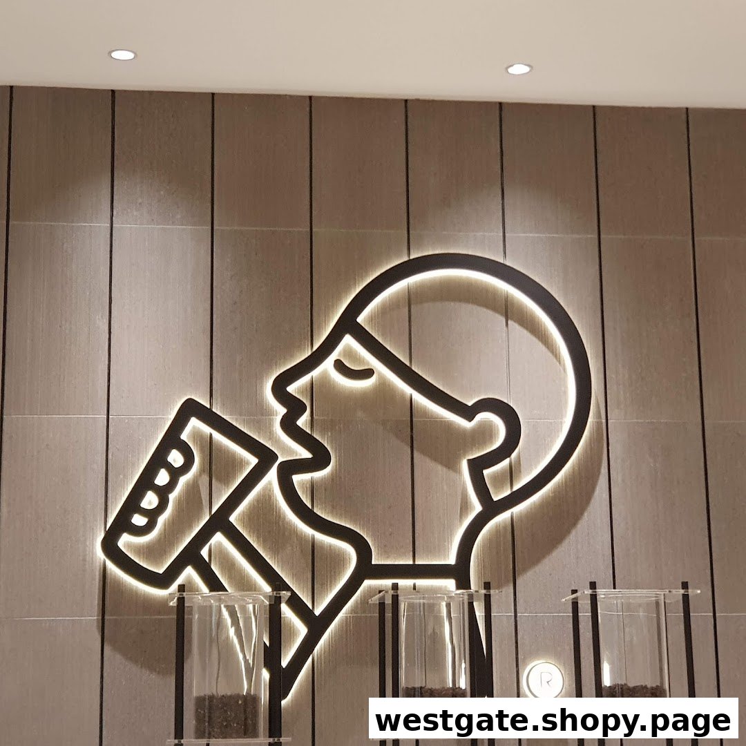 Illuminated line art logo of a person drinking on a textured wall inside HEYTEA.