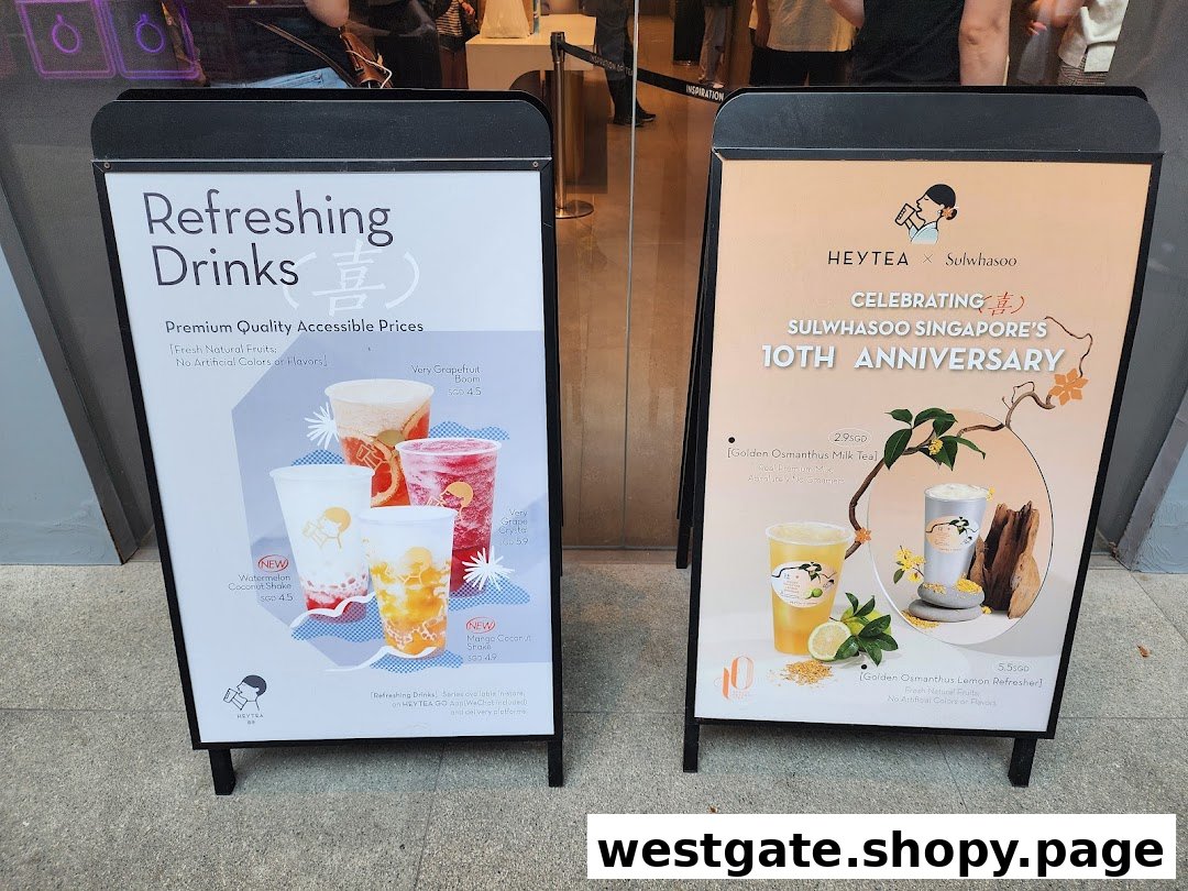 Two A-frame signs outside HEYTEA, showcasing refreshing drinks and a special collaboration menu.